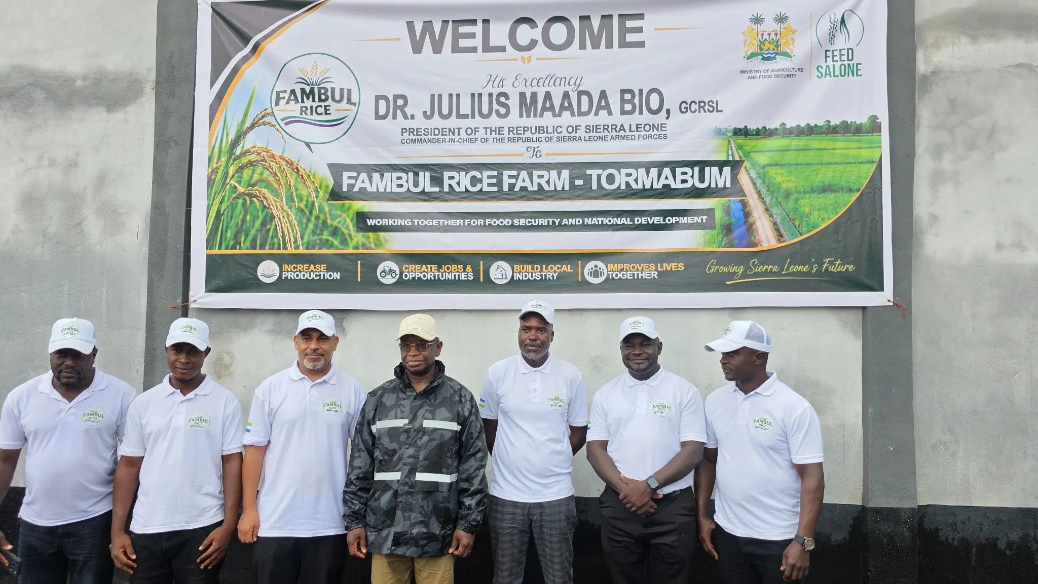 President Julius Maada Bio, centre, with the Fambul Rice team